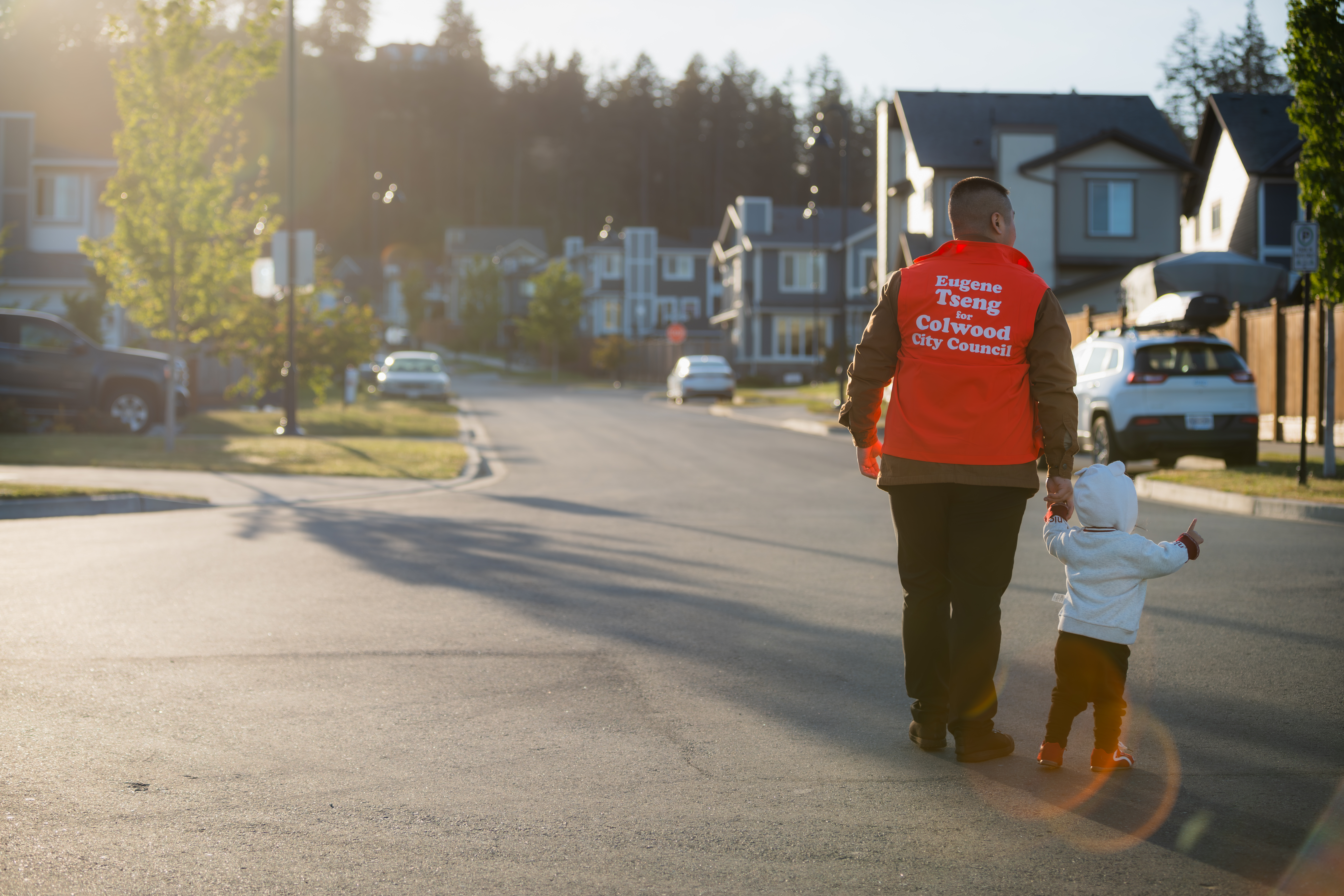 Eugene walking down a Colwood street with his daughter