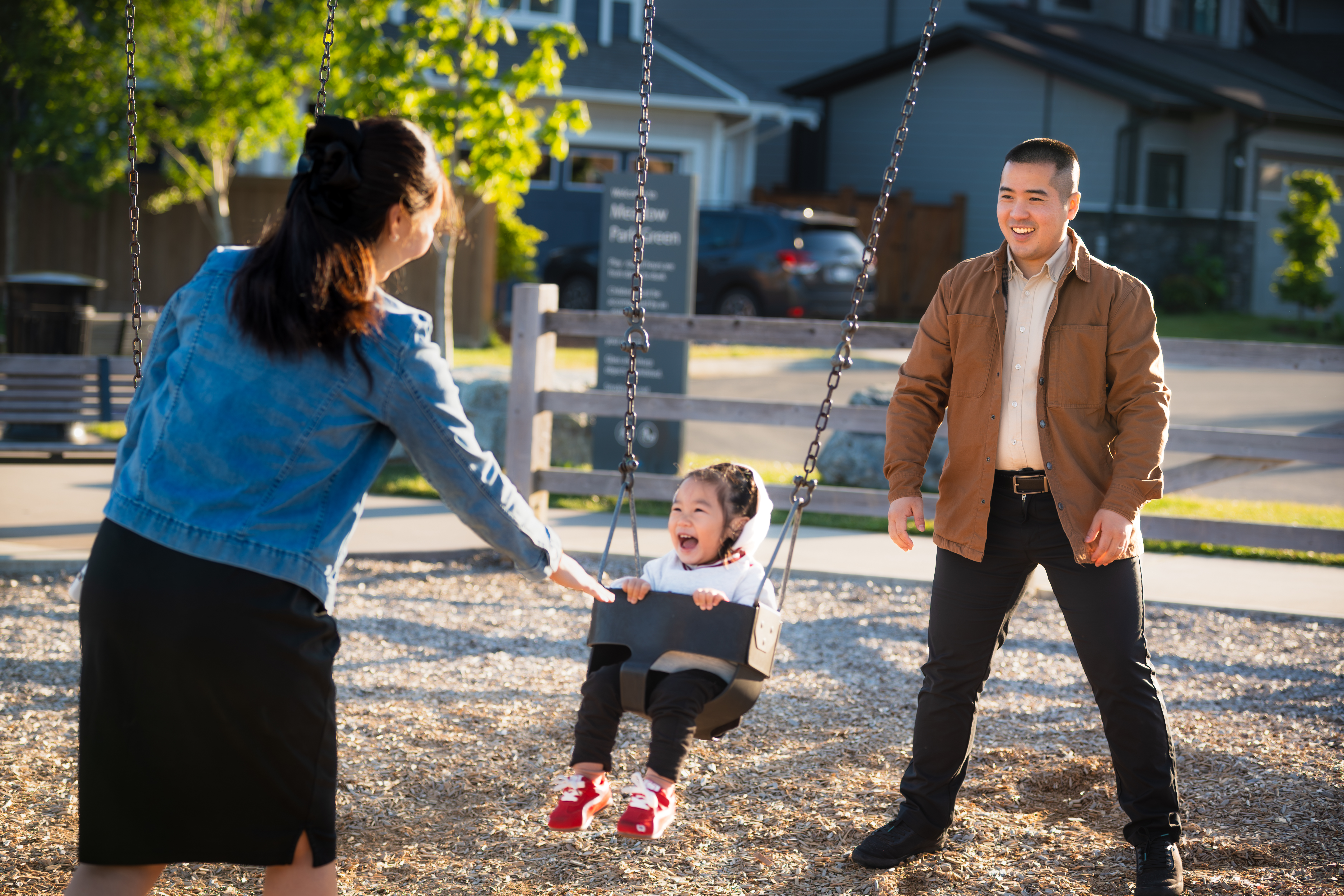 Eugene and family laughing at the playground in Royal Bay